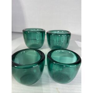 Lot of 4 sea green thick glass tea light holders.